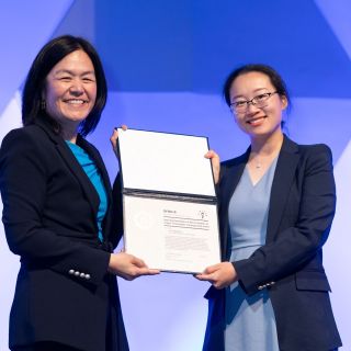 Yangying Zhu (right), assistant professor in the UCSB Mechanical Engineering Department, receives her award certificate from ARPA-E Program