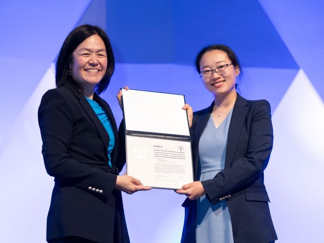 Yangying Zhu (right), assistant professor in the UCSB Mechanical Engineering Department, receives her award certificate from ARPA-E Program